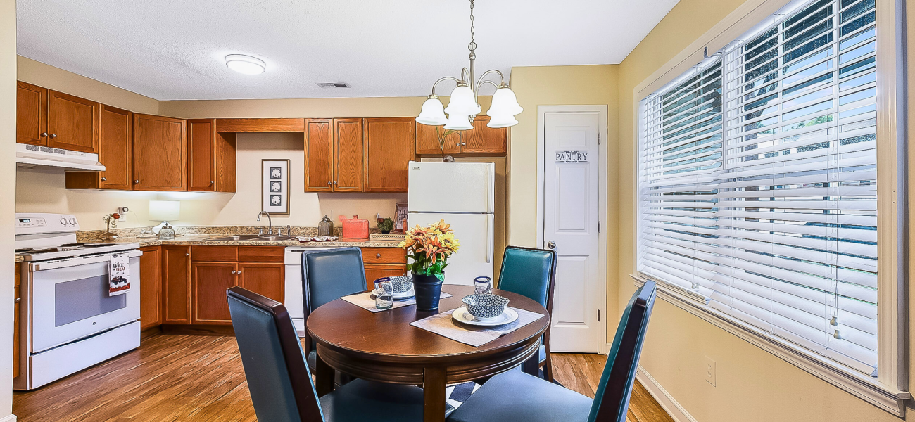Bright Kitchens in Meadow Creek spacious kitchen with easy access to other rooms & patio