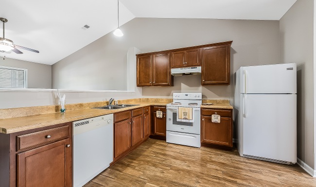 Gourmet kitchen at Meadow Creek gourmet kitchen with ample lighting and vaulted ceilings